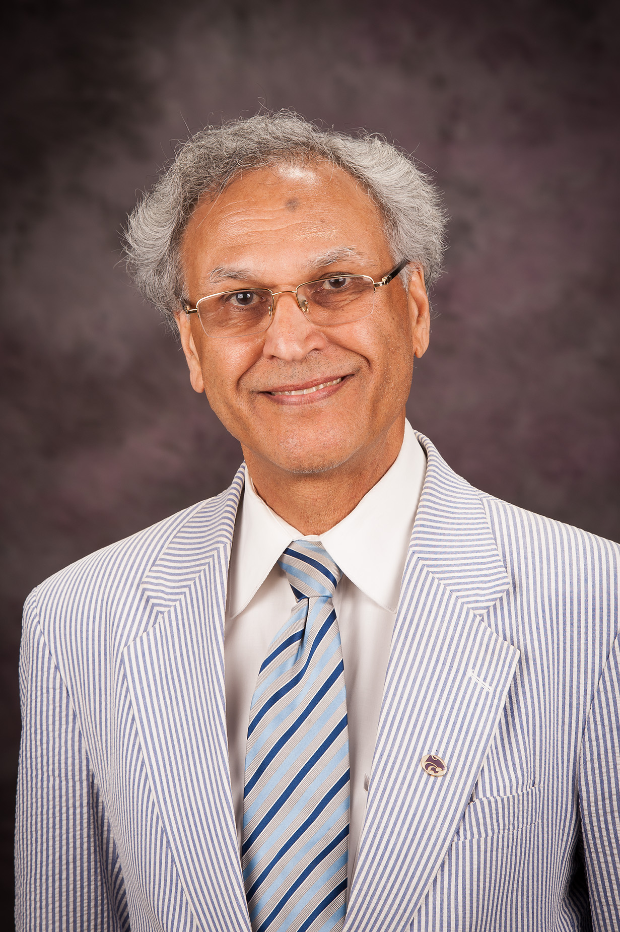 Dr. Manjit Kang