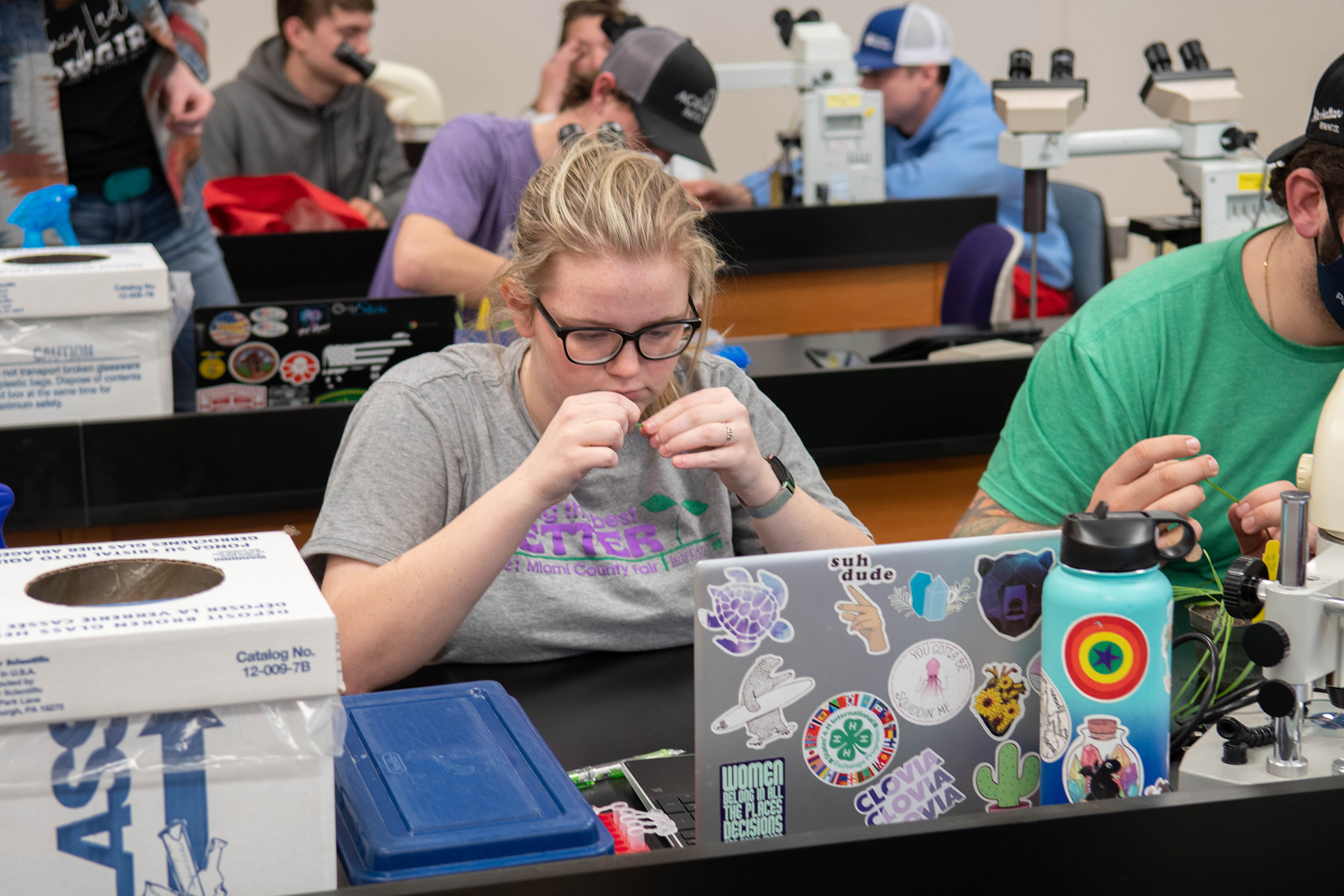 Student studying plants in lab